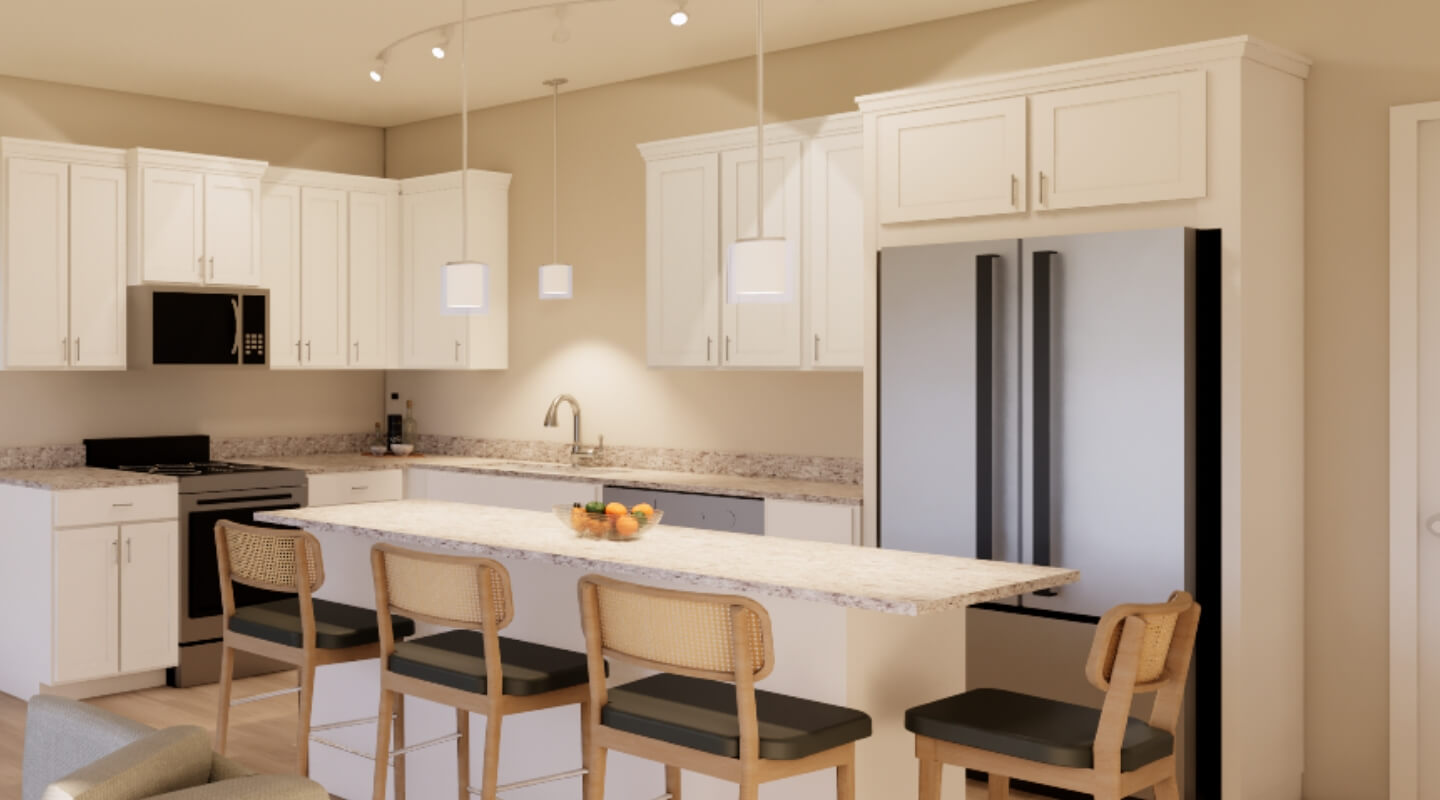 Modern kitchen with white cabinets, island seating, and stainless steel appliances at Brookgreen Townhomes